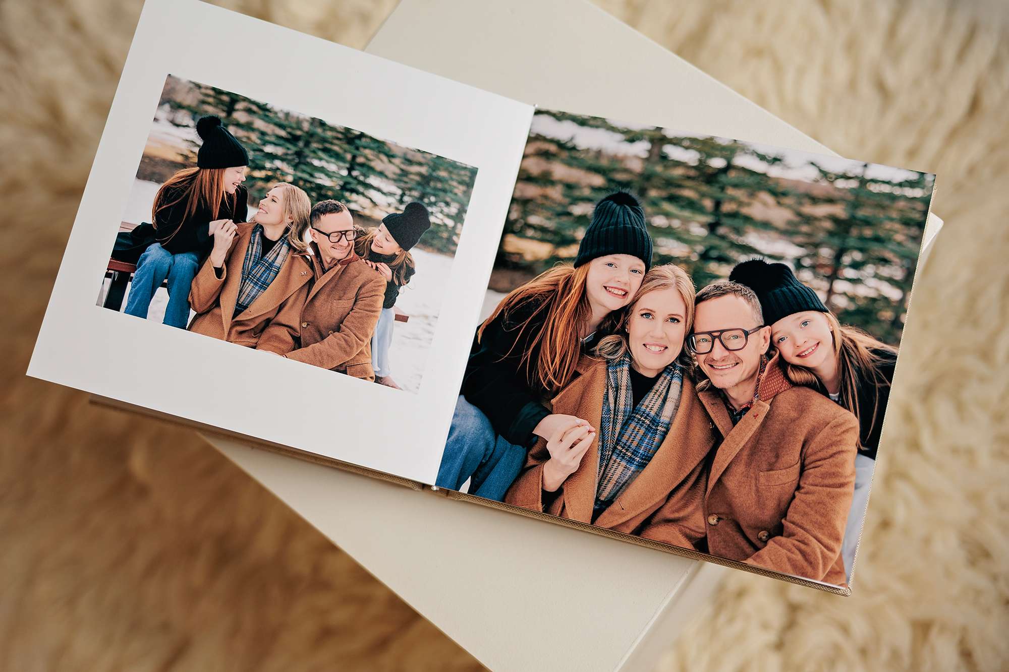 Family portraits displayed in album spread