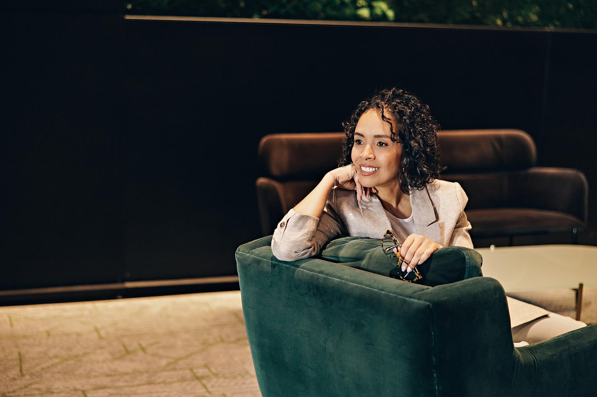 Calgary headshot photographer: Professional woman in a modern office setting for corporate personal branding