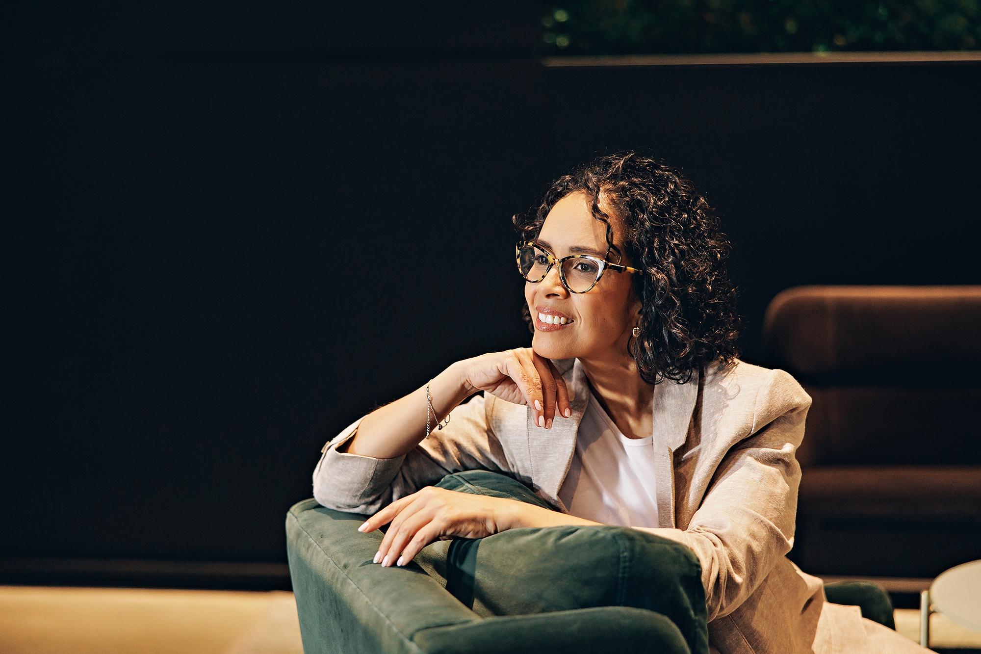 Business portraits in Calgary: Female executive in modern workplace for personal brand photography